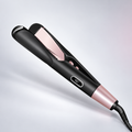 Black and rose-pink dual-purpose straightener — edited studio product image